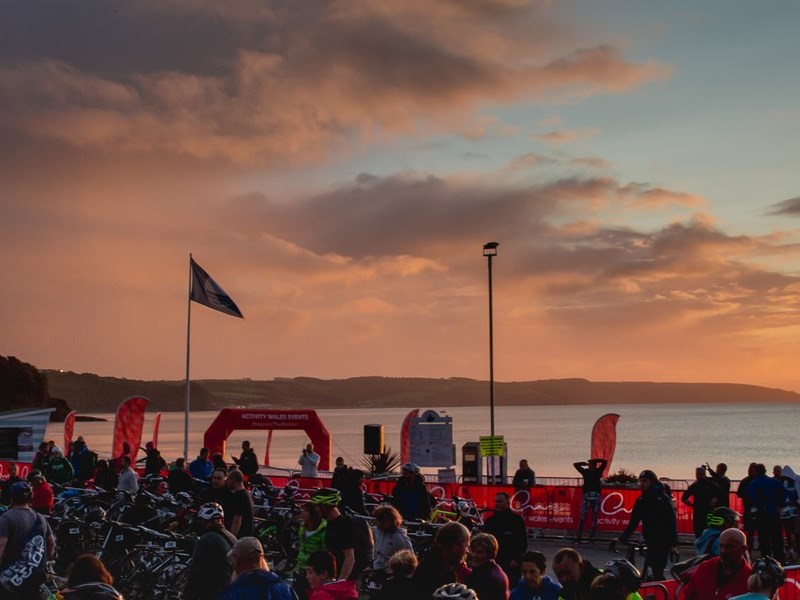 Dawn breaks over Saundersfoot Harbour at the start of the Saundersfoot Triathlon